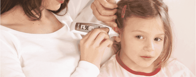A mother check's her young daughter's temperature using the Beurer Multi-Function Digital Thermometer.