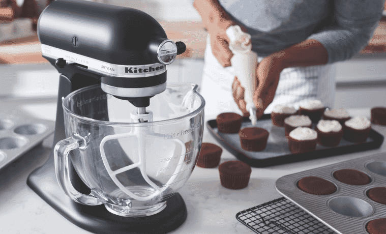 KitchenAid Stand Mixer on bench top next to delicious red velvet cupcakes